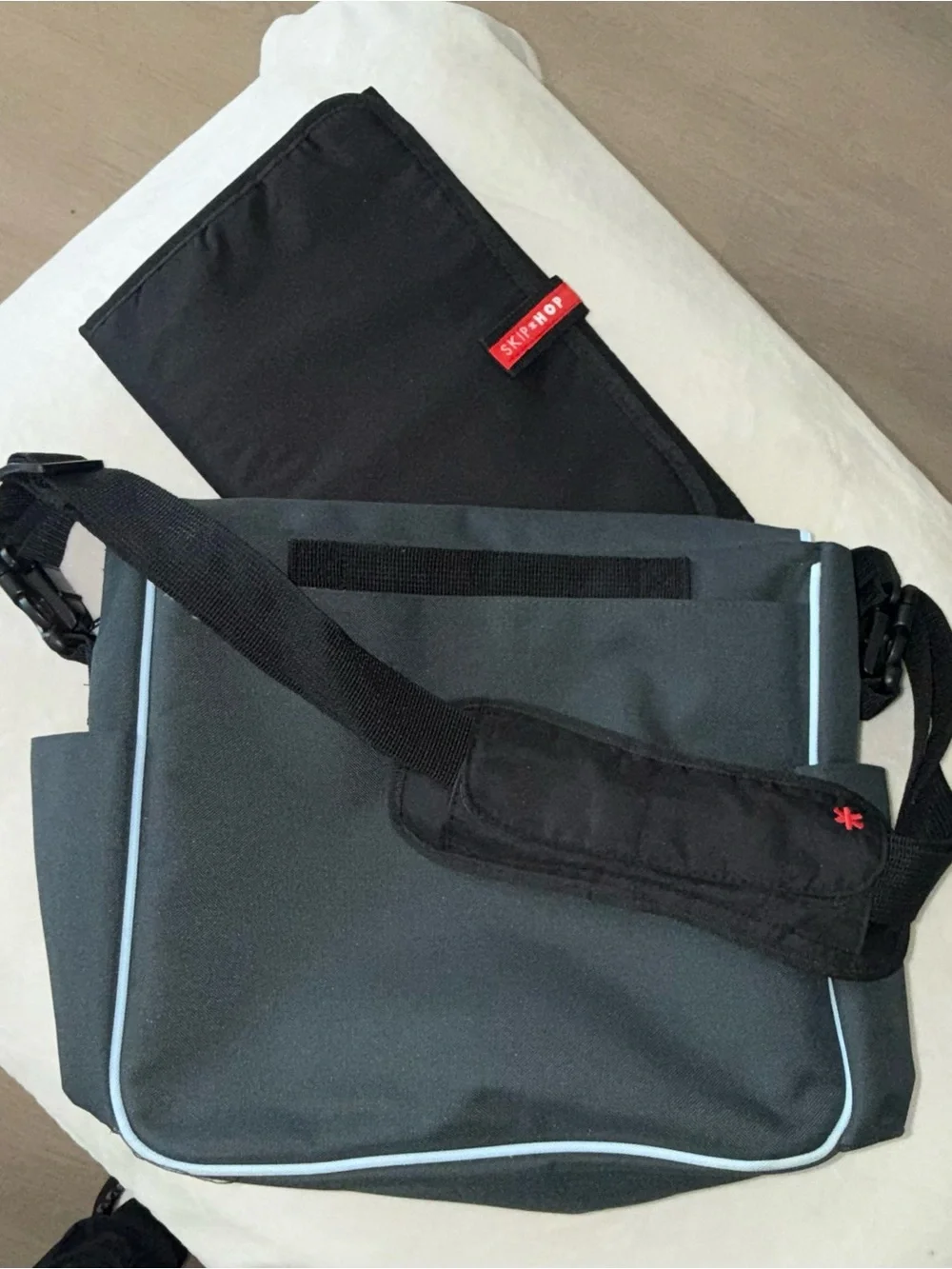 Skip Hop Black Messenger Bag with Light Blue Piping